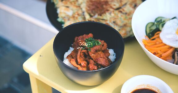 Chicken rice bowl, Singapore, Singapore. Unsplash: Ryan Kwow