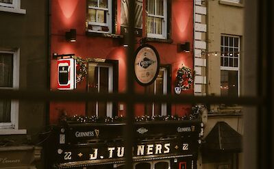 Pub in Tralee at Christmas, Kerry, Ireland. Unsplash@Denver Saldanha