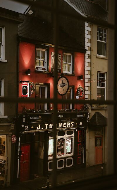 Pub in Tralee at Christmas, Kerry, Ireland. Unsplash@Denver Saldanha