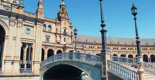 Water under a beautiful bridge at the Spain Square, Seville, Spain. Unsplash: ellena McGuinness