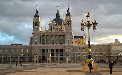 tourists outside the Royal Palace of Madrid, Spain. Unsplash: Jens Peter Olesen