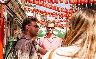 Engaging tour guide in Chinatown, Soho, London, England. CC: Eating Europe