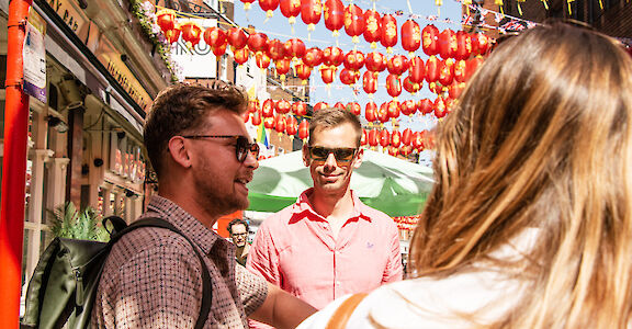 Engaging tour guide in Chinatown, Soho, London, England. CC: Eating Europe