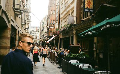 Pedestrians in Soho, London. Unsplash: Zach Rowlandson