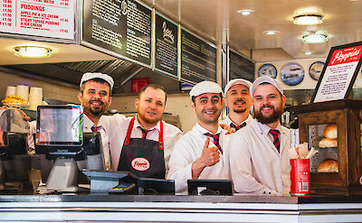 Gentlemen ready to serve fish and chips for takeaway in London, England. CC: Eating Europe
