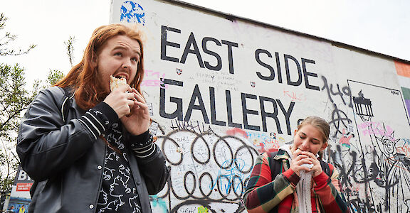 Munching at the East Side Gallery, berlin, Germany. CC: Eating Europe