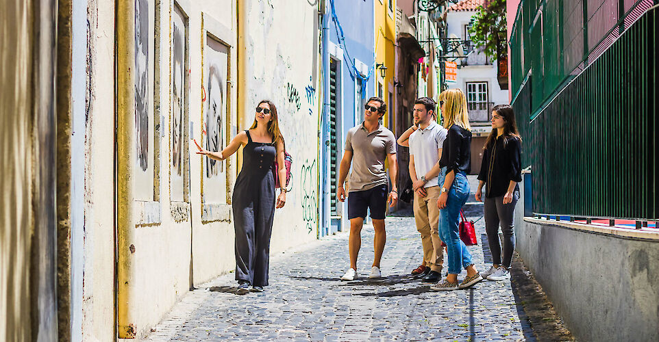 Looking at local art, Lisbon, Portugal. CC: Eating Europe