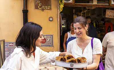 Trying local pastries, Rome.