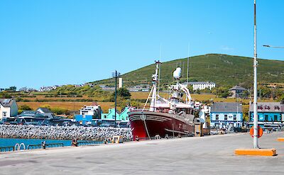 Boats in Dingle Harbour, Ireland. Unsplash@Dahlia E Akhaine