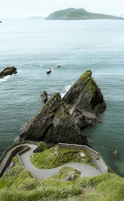 Curved path in Dunquin, Ireland. Unsplash@Pascal Bullan