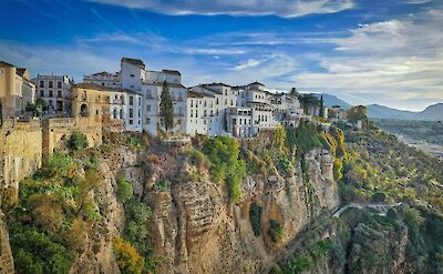 Whitewashed buildings perched above El Tajo Gorge. pixabay:rainhard2