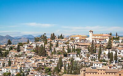 The whitewashed hillside of Granada's Albaic&iacute;n district. unsplash:dimitryB