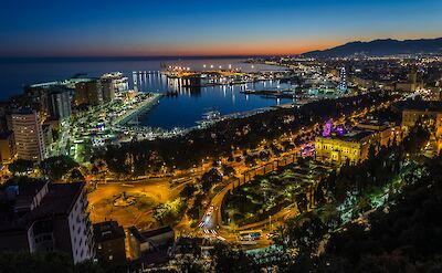 M&aacute;laga's waterfront and Muelle Uno at dusk. unsplash:DavidBecker