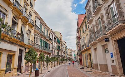 A lively street in M&aacute;laga's historic center. unsplash:ChristianHergesell