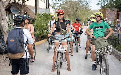 Listening to the guide on a bike tour, Tulum, Mexico. CC:Mexico Kan Tours