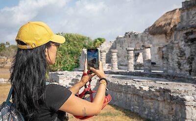 Taking a photo of the ruins, Tulum, Mexico. CC:Mexico Kan Tours