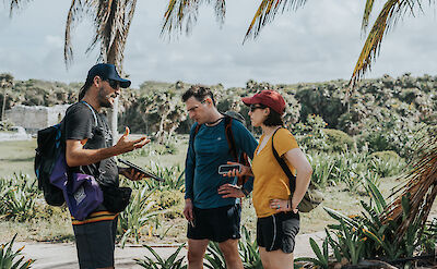 Tour guide talking to customers, Tulum, Mexico. CC:Mexico Kan Tours