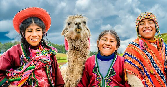 Children & llamas in Peru! Unsplash:Alexander Schimmeck