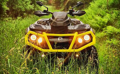 ATV with headlights on. Timotheus Frobel@Unsplash