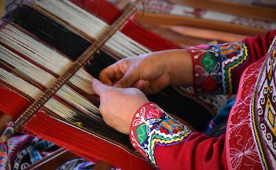 Woman weaving wool in Peru! Unsplash:Jean Vella