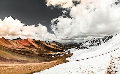 Snow in Vinincunca. Unsplash:Aarom Ore