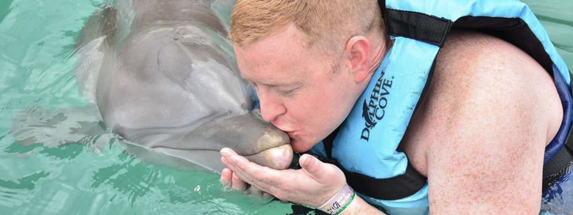 Kissing a dolphin, Ocho Rios, Jamaica.
