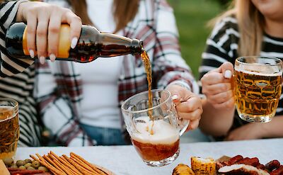 Pouring a German beer, Germany. Kateryna Hliznitsova@Unsplash