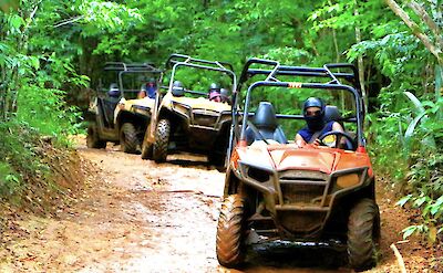 Convoy of ATV buggies in the forest, Jamaica. CC:El Sol Vida