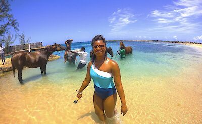 Wading in the water with the horses, Jamaica. CC:El Sol Vida