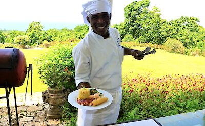 Chef serving a dish, Jamaica. CC:El Sol Vida