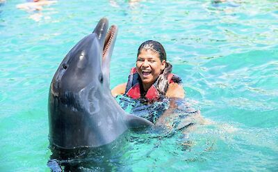 Playing with a dolphin, Blue Lagoon Island, Bahamas. CC:El Sol Vida