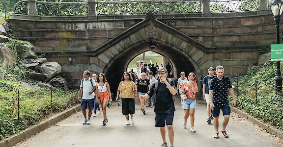 Tour guide leading the group through Central Park, New York, USA. CC:Unlimited Biking