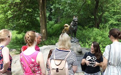 Tour guide talking about a statue, Central Park, New York, USA. CC:Unlimited Biking