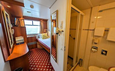 1-bed cabin and bathroom aboard the MS Rigoletto | Holland Bike & Boat Tours