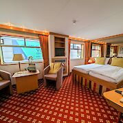 Junior Suite offering a cozy sitting area | Rigoletto | Bike & Boat Tour