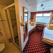 2-bed Standard Cabin and bathroom | Rigoletto | Bike & Boat Tour