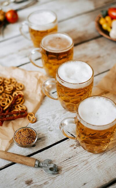 Sampling German beer. Unsplash: Kateryna Hliznitsova