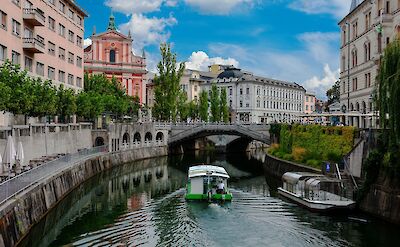 A Boat ride on Ljubljanica River. Unsplash:Eugene Kuznetsov