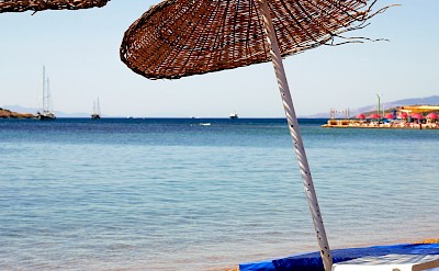 Parasol on the beach, Bodrum, Turkey. Unsplash@Ali Pourfarahani