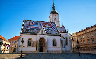 Blue skies above St. Mark's Church, Zagreb, Croatia hiking tour. Unsplash@Getty Images