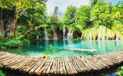 Boardwalk over a lake in Plitvice Lakes National Park, Croatia hiking tour. Unsplash@Getty Images