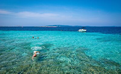 Swimming in vivid turquoise water. toST
