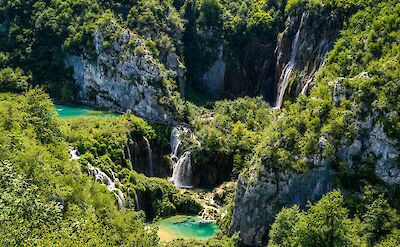 Drone shot of waterfalls in Plitvice Lake National Park, Croatia hiking tour. Unsplash@Tim I Productions