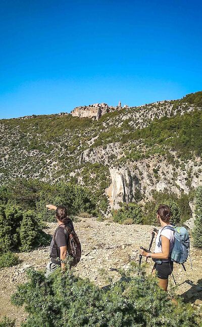 Hiking through rugged limestone terrain. toST