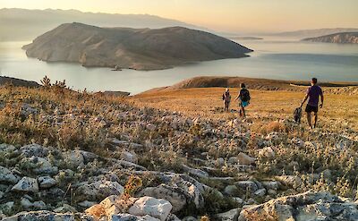 Hiking across open island terrain. toST