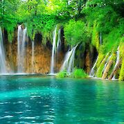 Croatia’s Plitvice Lakes & Adriatic Islands - Waterfalls and foliage in Plitvice Lakes National Park, Croatia hiking tour. Unsplash@Getty Images