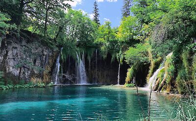 Waterfalls around a lake in Plitvice Lakes National Park, Croatia hiking tour. Unsplash@Marlene Celine Nordvik
