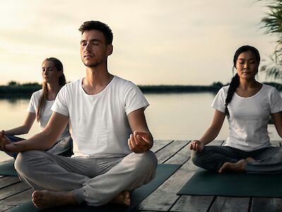 Yoga class on a corporate wellness retreat. Getty Images@Unsplash