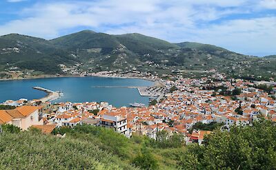 Skopelos Town is a hillside port with whitewashed houses, cobblestone streets, and stunning Aegean views. toIH