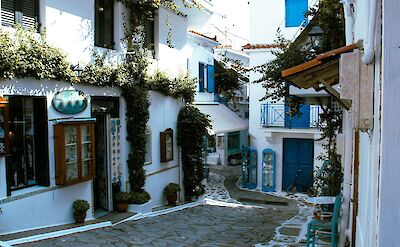 A typical street in Skiathos Town. unsplash:Stratiya stratiev